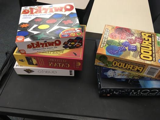 Two stacks of three board games